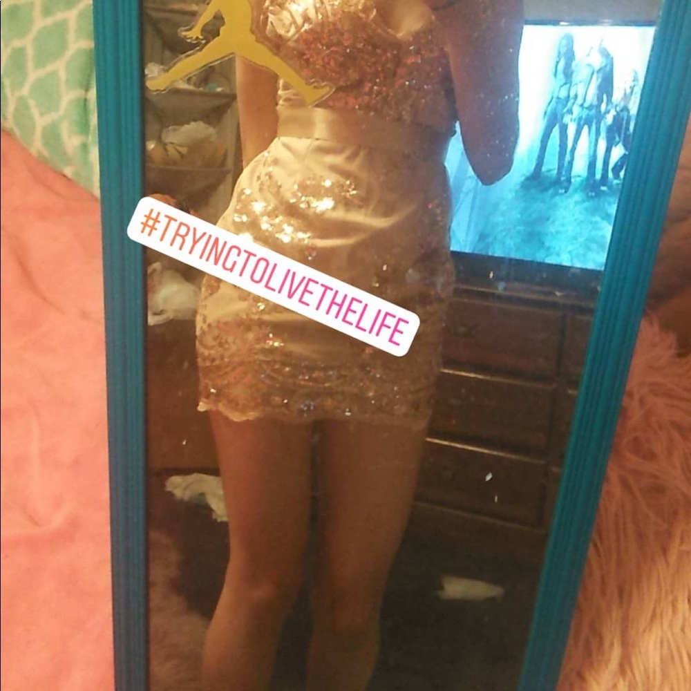 A gold sequence party dress🤩